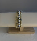 Gold-filled and white-and-black glass evil eye bracelet stack