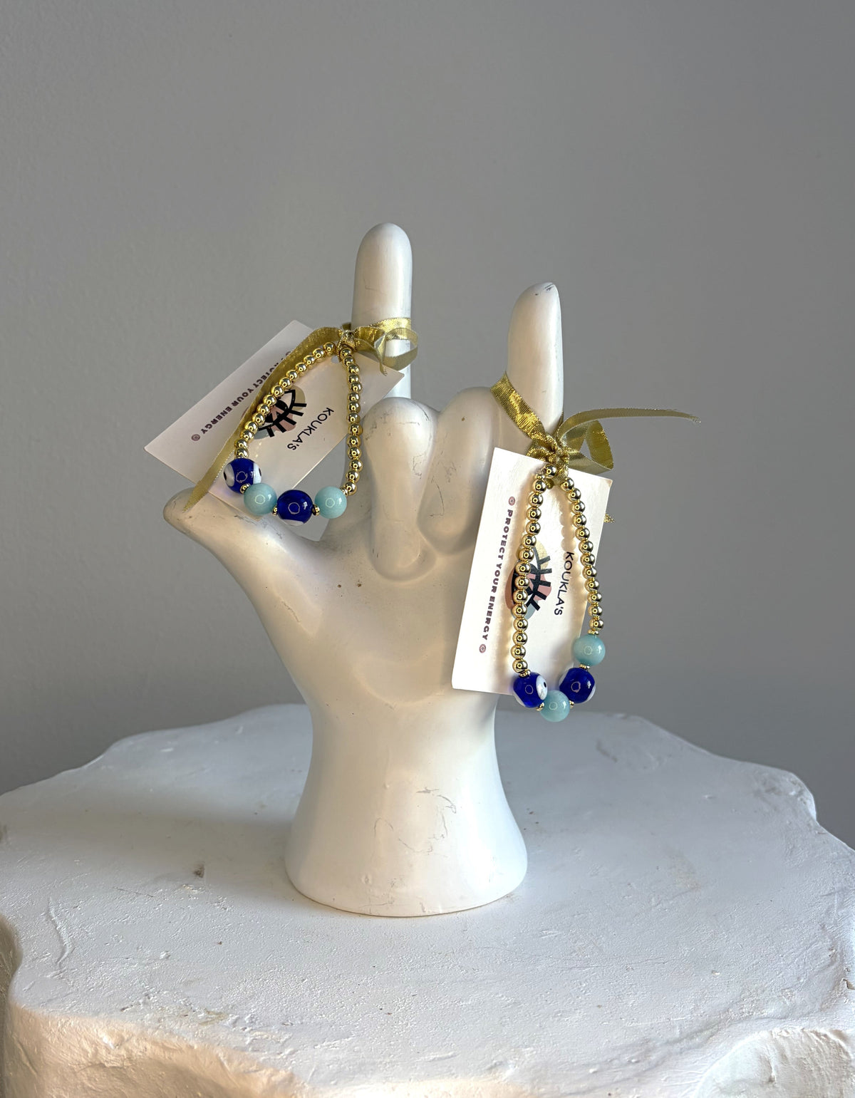 Gold-filled bracelet with turquoise beads and blue glass evil eyes
